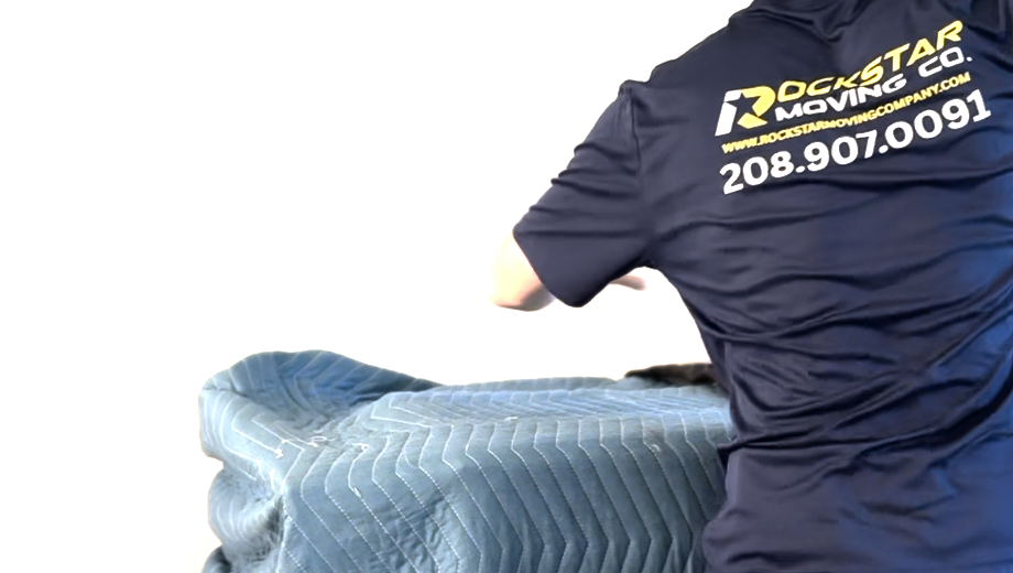 Professional mover loading furniture for a residential move.