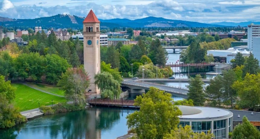Portland skyline with river and clock tower, showcasing professional moving services in the city.